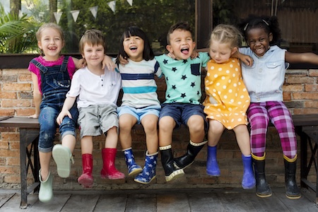 children sitting on bench